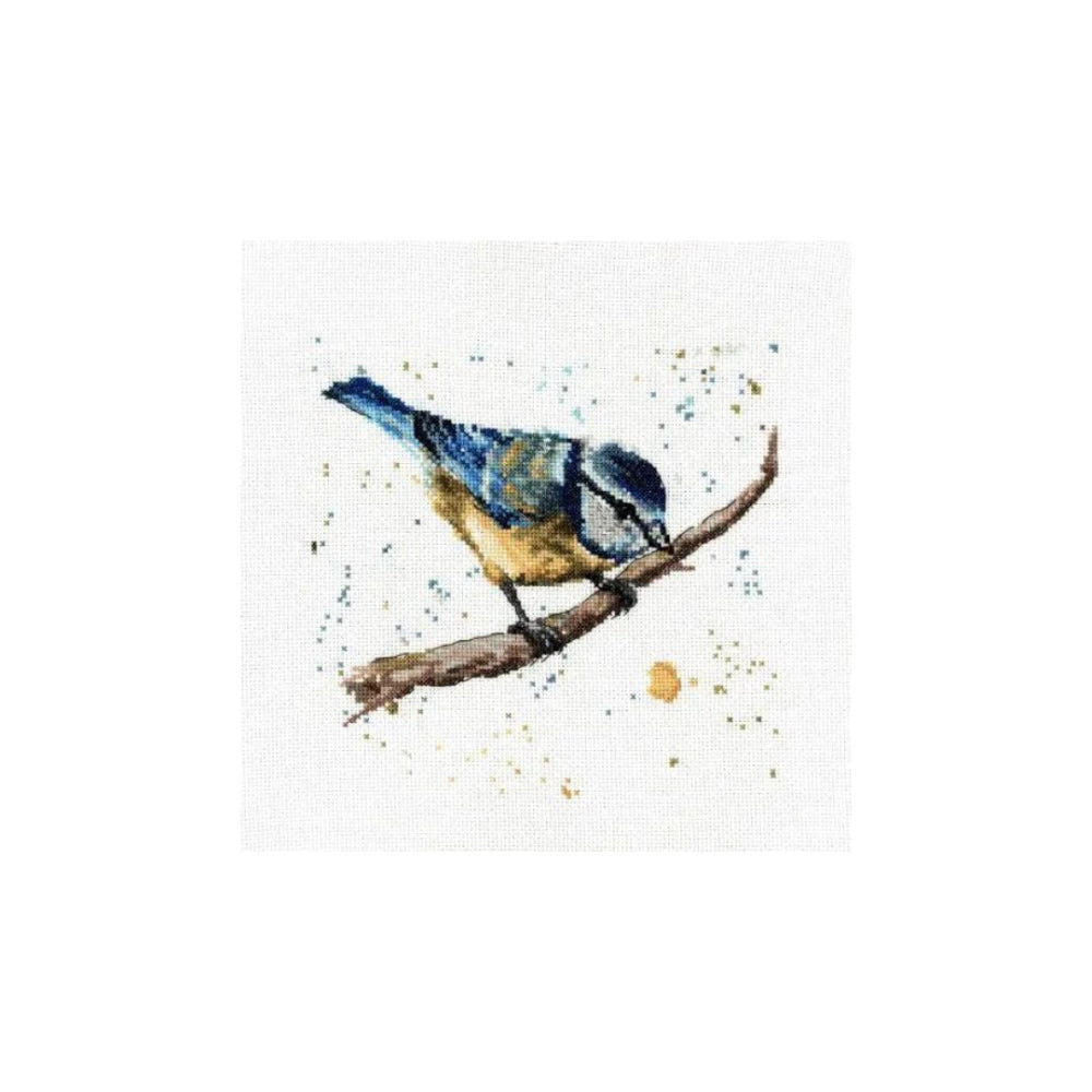 A watercolor-style bird painting on a white square canvas, showing a small bluebird perched on a brown branch with scattered paint splatters around it.