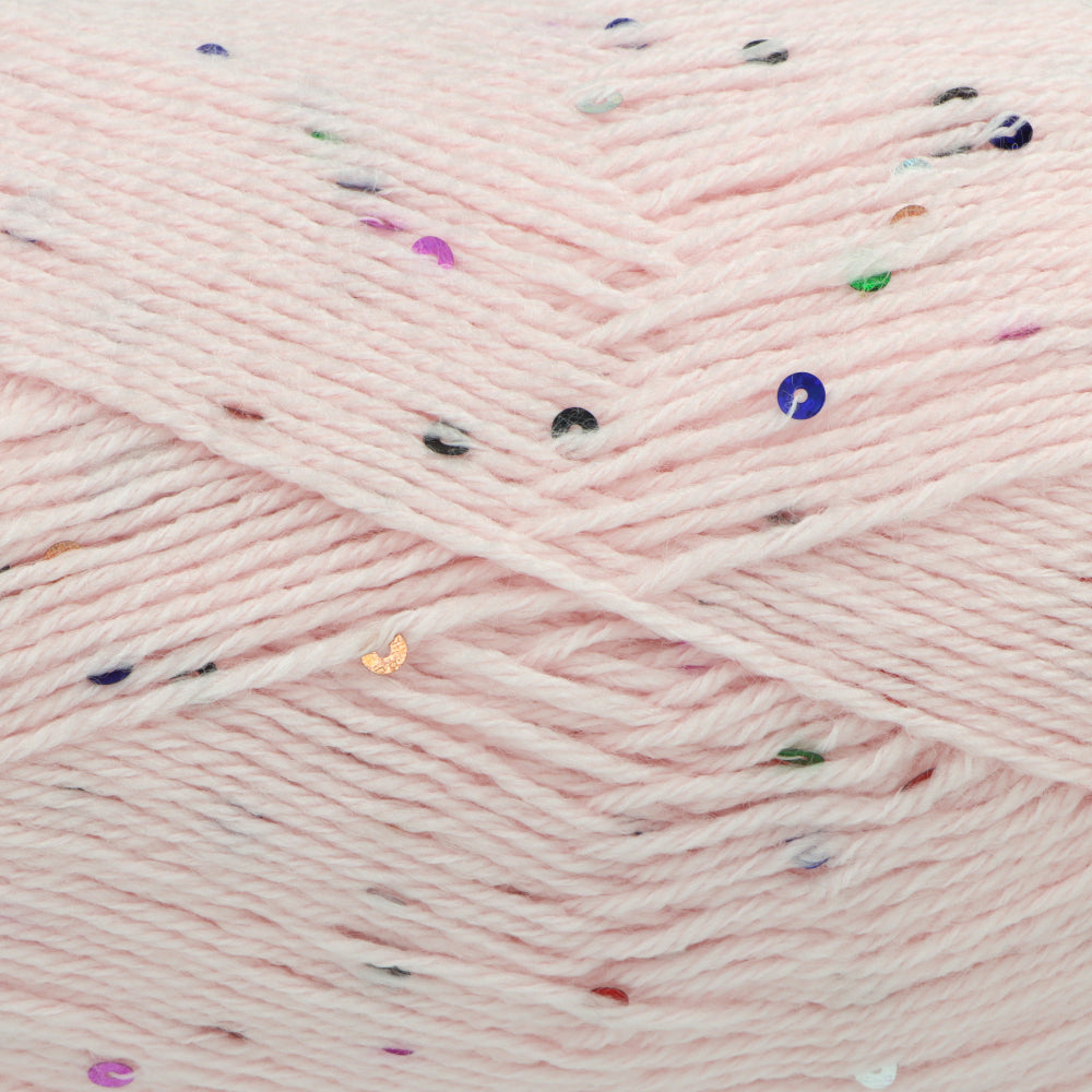 Close-up of pale pink yarn with scattered multicoloured sequins