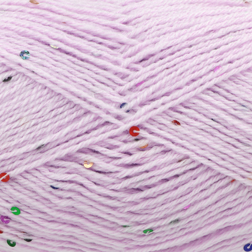 Close-up of light lavender yarn with scattered small sequins in red, green, blue, and gold.