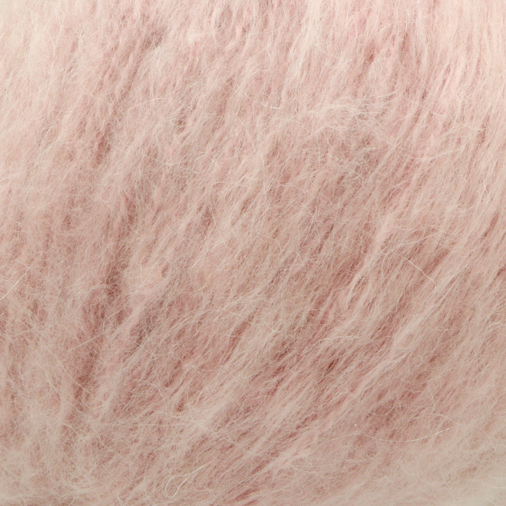 A close-up texture shot of fluffy, soft yarn filling the entire frame.