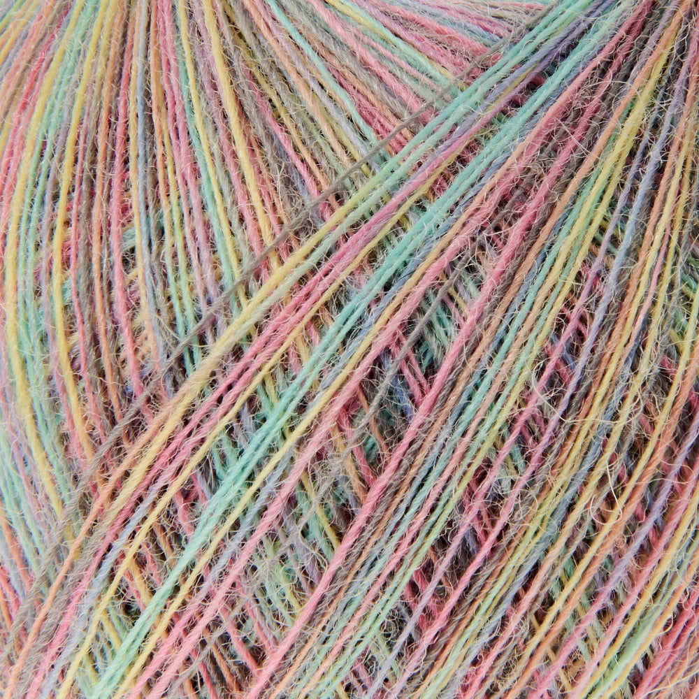 Close-up of variegated yarn strands in pastel pink, mint green, pale yellow, and light blue, filling the frame.