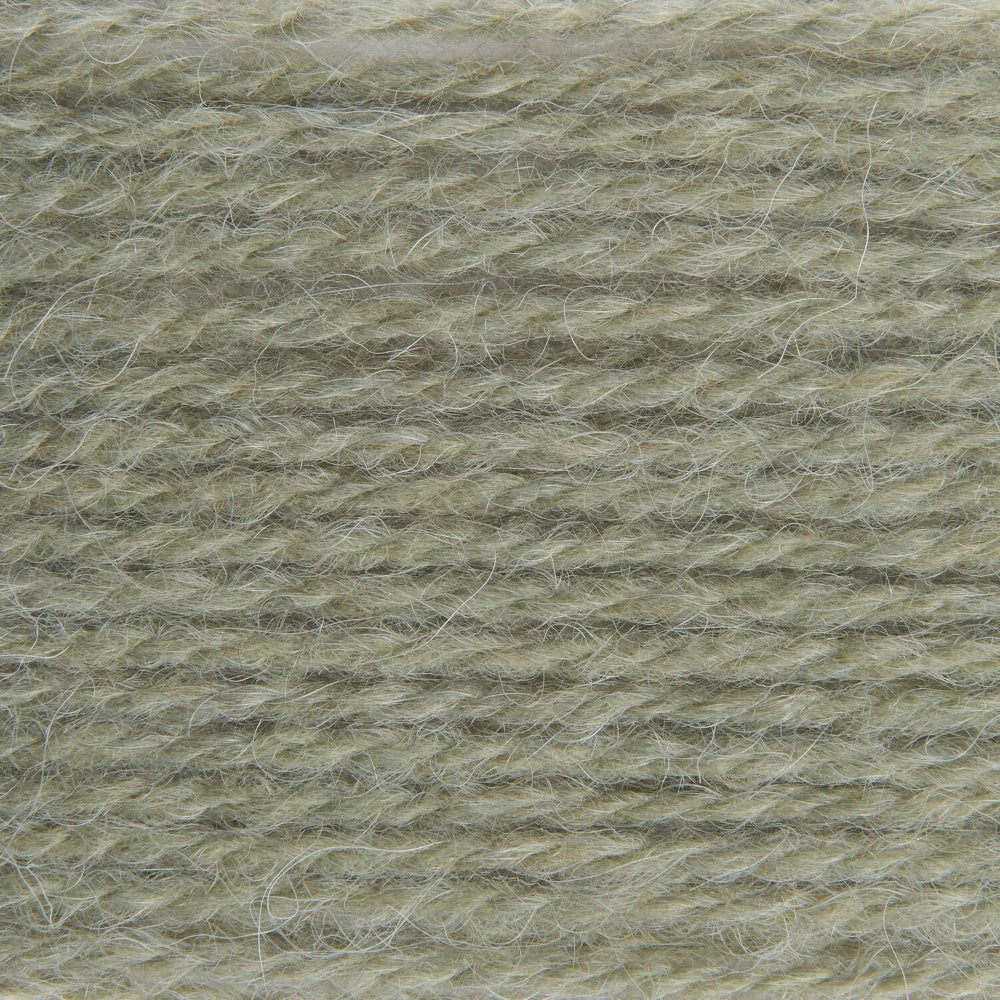 A close-up texture shot of a soft, fuzzy yarn or fleece material in a muted sage green-gray color.