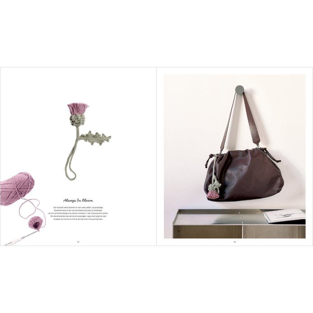 A split-page catalog or magazine spread showing a dark brown leather shoulder bag hanging on a wall hook, alongside a crocheted flower accessory and yarn on a white background.