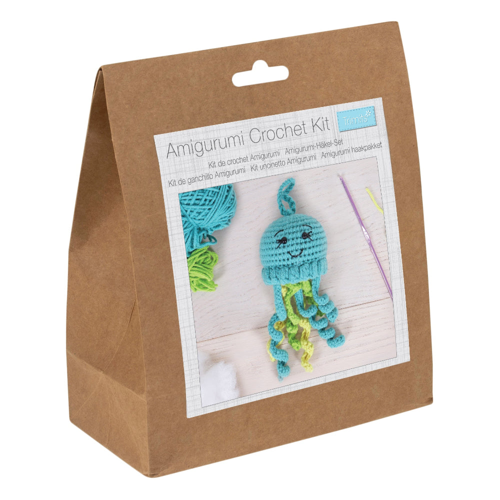 Amigurumi crochet kit packaging with a blue and green crochet jellyfish on a white background