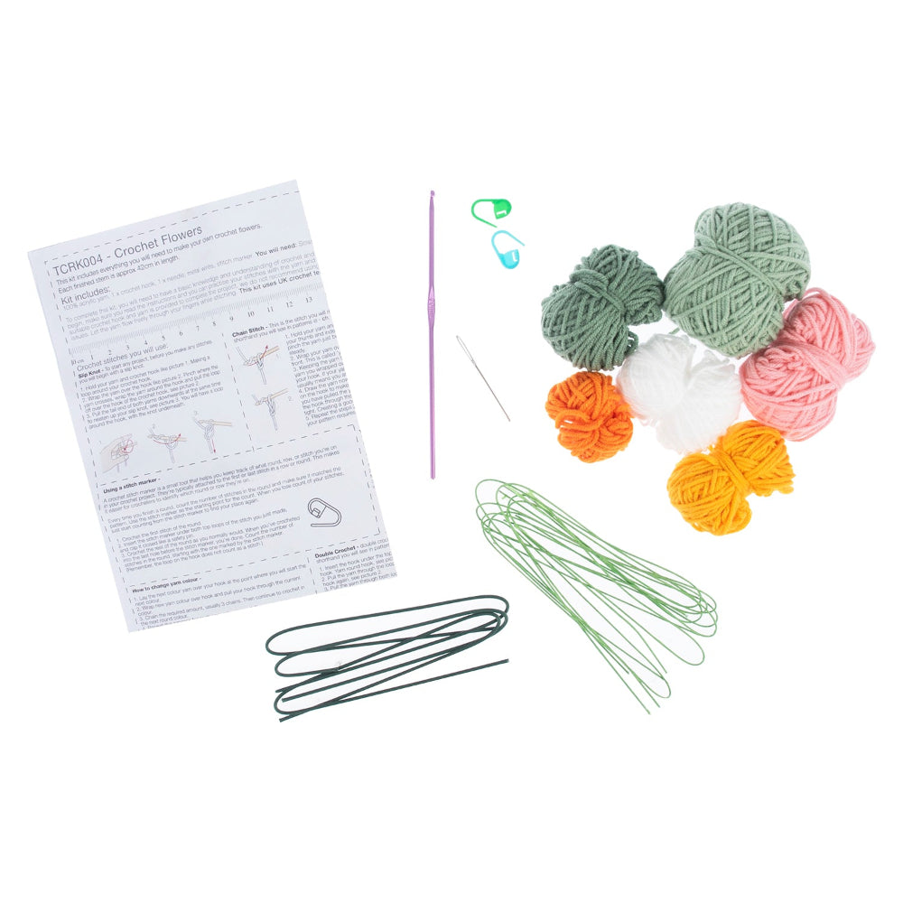 Crochet kit with yarn, hooks, and instructions on a white background