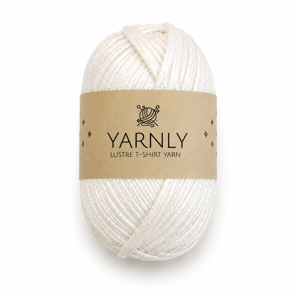 A skein of Yarnly Lustre T-Shirt Yarn in a warm off-white/cream color, wrapped in a brown kraft paper label, on a clean white background.