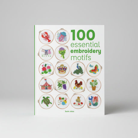 Front cover of a book titled "100 essential embroidery motifs" by Susie Jones, showing a grid of colourful embroidered motif samples on a white background.