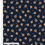 Navy blue fabric with a repeating pattern of gold baubles and stars, shown with a white measurement ruler on the left side.