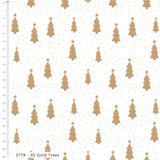 White fabric with a repeating pattern of gold Christmas trees and small gold stars, shown with a measurement ruler on the left side.