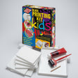 Block printing kit for kids with packaging, printing plates, and tools on a white background
