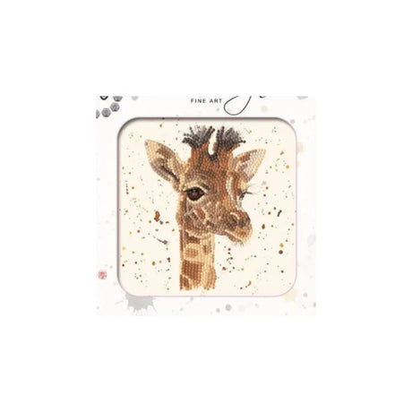A square framed art print featuring a painted giraffe head on a light cream background with subtle paint splatters. The print is presented in a white frame with decorative gray and black accents, and the words 'FINE ART' are printed at the top.