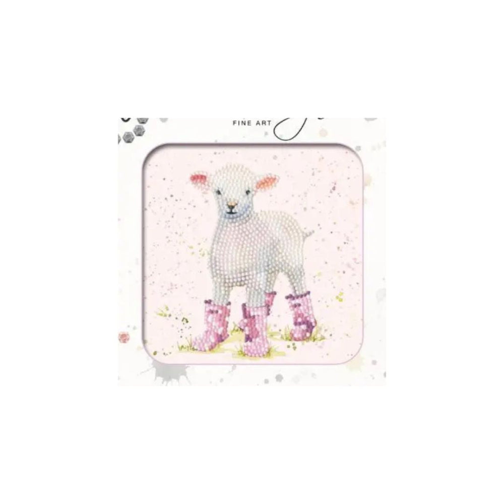 A square framed art print featuring a white lamb wearing pink rain boots on a light pink watercolor background, with the words 'FINE ART' printed at the top.