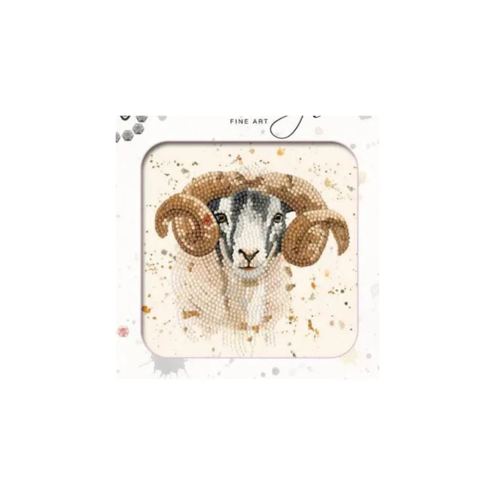 A square framed art print featuring a mosaic-style ram with large curved horns on a cream background with subtle gold speckles. The print is presented in a white frame with the text 'FINE ART' visible at the top.