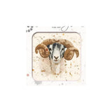 A square framed art print featuring a mosaic-style ram with large curved horns on a cream background with subtle gold speckles. The print is presented in a white frame with the text 'FINE ART' visible at the top.