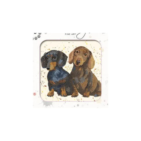 A diamond painting or craft kit featuring an illustration of two dachshunds, one black and tan and one brown, on a speckled cream background. The package has a white border with 'FINE ART' printed at the top.