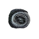 A single ball of variegated yarn with a spiral colour transition from black and charcoal to light grey, featuring subtle white flecks throughout, set against a plain white background.