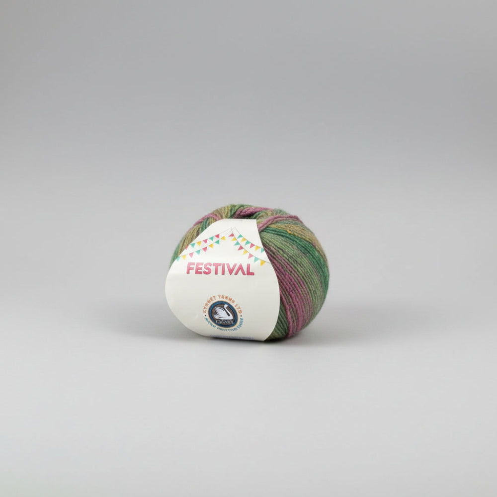A ball of variegated yarn with green, pink, and yellow tones, wrapped in a white paper label that reads 'FESTIVAL' and shows the Cygent Yarns logo, on a plain white background.