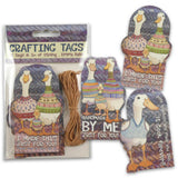Crafting tags with duck designs and string, branded 'Emma Ball'.