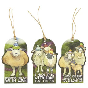 Three arched gift tags with hanging twine, each featuring a watercolor-style sheep illustration and a humorous quote on a white background.