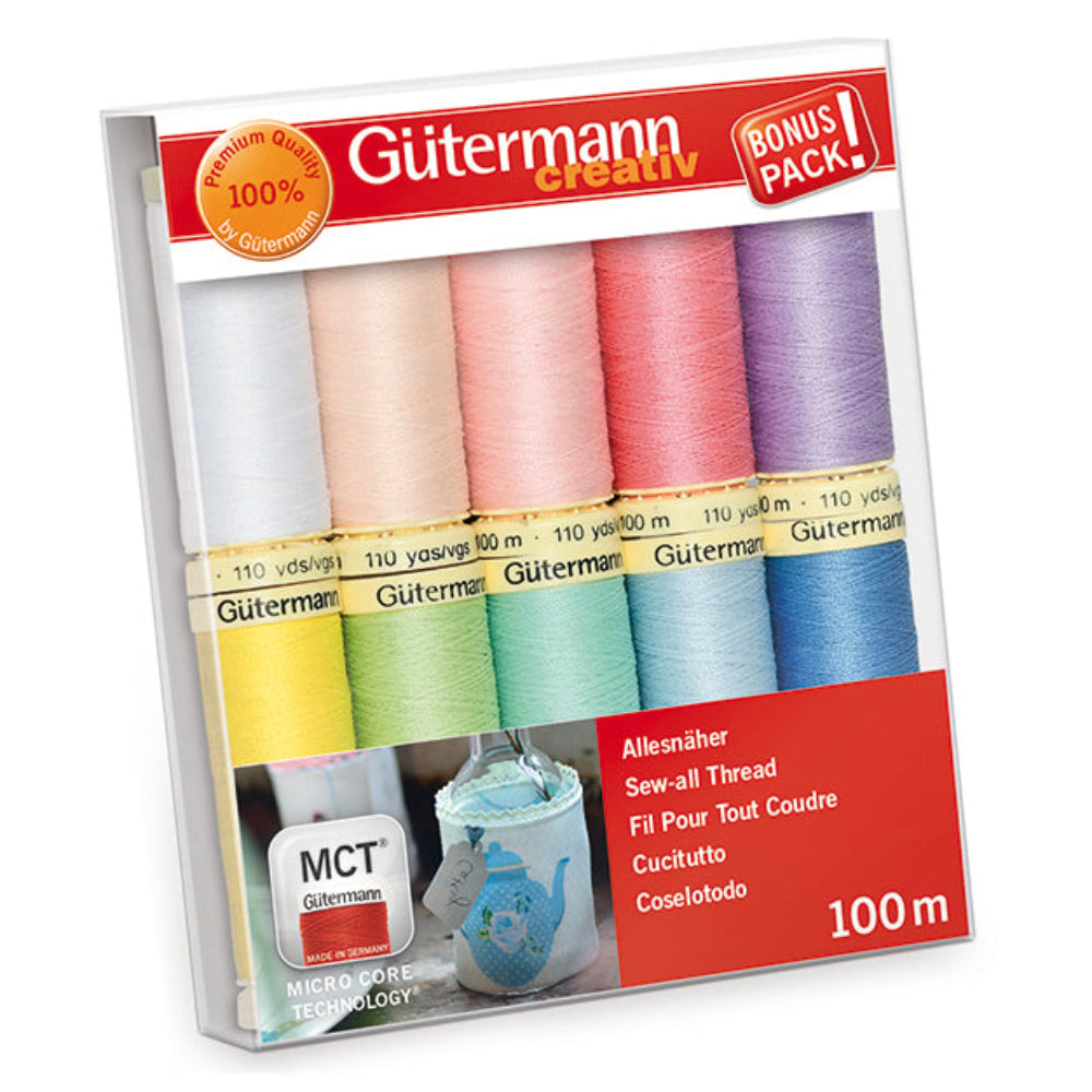 Pack of Gütermann thread with colourful pastel spools on a white background