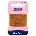 A package of Hemline premium quality gold sewing thread, 10 meters, wound on a cardboard spool with a pink header card and a navy blue brand label at the bottom.