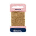 A 10-meter spool of Hemline light gold embroidery thread in its original pink and navy blue retail packaging, shown against a plain white background.