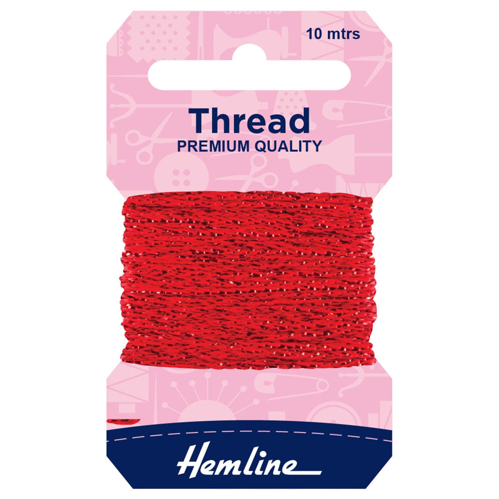 A package of Hemline red sewing thread, 10 meters long, wound around a pink and navy blue cardboard hanger.