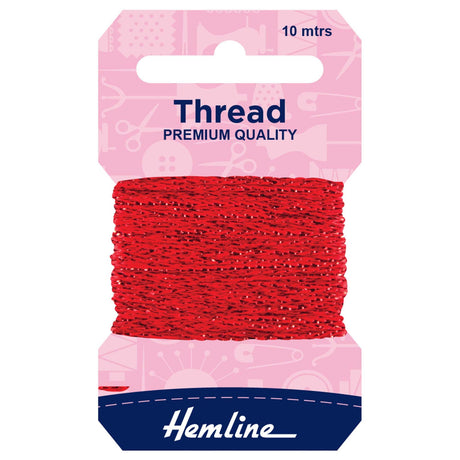 A package of Hemline red sewing thread, 10 meters long, wound around a pink and navy blue cardboard hanger.