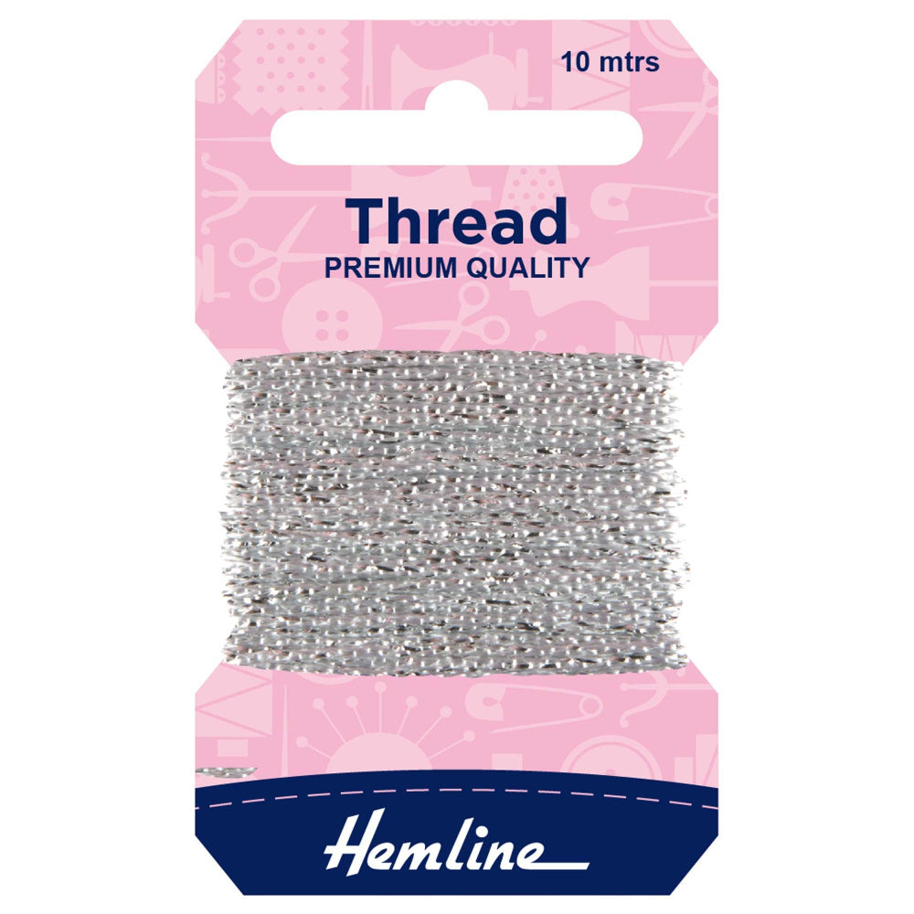 A package of Hemline silver sewing thread wound around a cardboard hanger, with a pink header card and a navy blue brand section at the bottom.