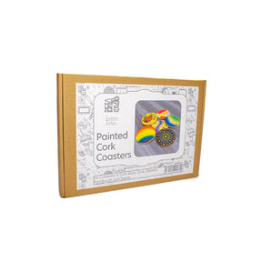 A cardboard box for a 'Painted Cork Coasters' kit, featuring a white label with a photo of colourful painted coasters and the brand name 'The Cork Coaster Company'.