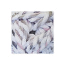 Chunky fuzzy yarn in a variegated white, gray, beige, and soft pink colorway, shown in a close-up texture shot.