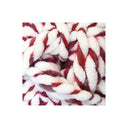 Chunky plush  chenille yarn in white and deep red, shown in a close-up view against a white background.