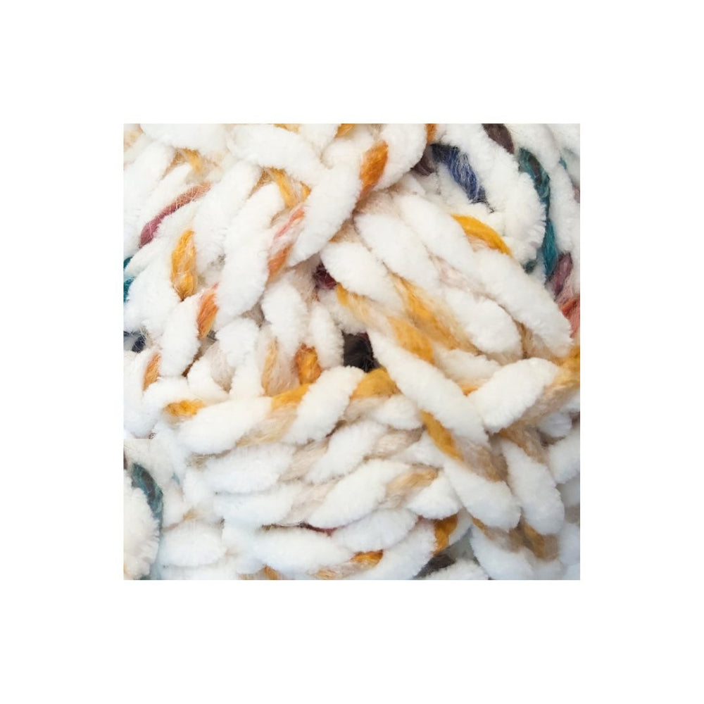 A close-up of chunky, thick yarn with a fluffy texture, primarily white with variegated accents of mustard yellow, orange, and hints of blue and green.