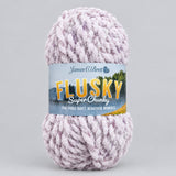 A large ball of James C. DBrett 'Flusky' Super Chunky yarn in a soft, pale pink and white variegated colour.