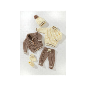 A baby knit clothing set laid flat on a white textured background, including a cream cable-knit sweater, a brown cable-knit cardigan, matching brown pants with a cream bow, a cream beanie with a brown pom-pom, and cream booties.
