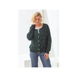 A woman wearing a dark green and blue textured knit cardigan with gold buttons, paired with blue jeans, standing against a white geometric studio background.
