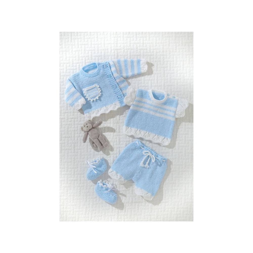 A baby knit clothing set laid out on a textured white background, including a light blue and white striped sweater, a matching top with white lace trim, a pair of light blue shorts with white lace trim and drawstring, a pair of matching booties, and a small gray plush bunny.