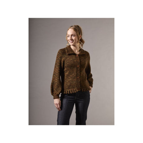 A woman modeling a brown textured knit cardigan with a collar and button-front closure, paired with dark jeans, against a solid gray studio background.