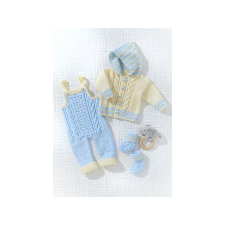 A baby knit clothing set laid flat on a white textured background, including a pale yellow hooded cardigan with light blue trim, a light blue cable-knit romper with pale yellow trim, matching booties, and a small gray teething ring.