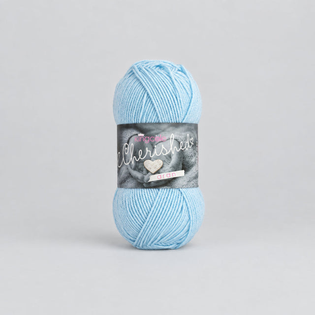 A skein of light blue yarn with a dark gray paper label, centered on a plain white background.