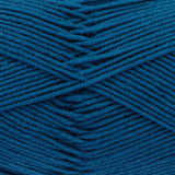 A close-up of textured blue yarn wound in diagonal layers, showing the twisted plies and fabric-like surface.