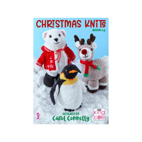 Front cover of the book 'Christmas Knits Book 13' by Carol Connelly, featuring three knitted holiday characters: a white polar bear in a red sweater and scarf, a brown reindeer with a red nose and scarf, and a penguin with a yellow scarf, set against a light blue sky and white snowy ground.