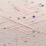 Close-up of pale pink yarn with scattered multicoloured sequins