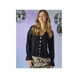 A woman modeling a black knit cardigan with white buttons, featuring a V-neck and ruffled cuffs, set against a lavender background with hanging disco ball decorations.
