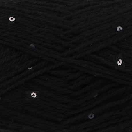 Close-up of black yarn with scattered small silver sequins woven throughout.
