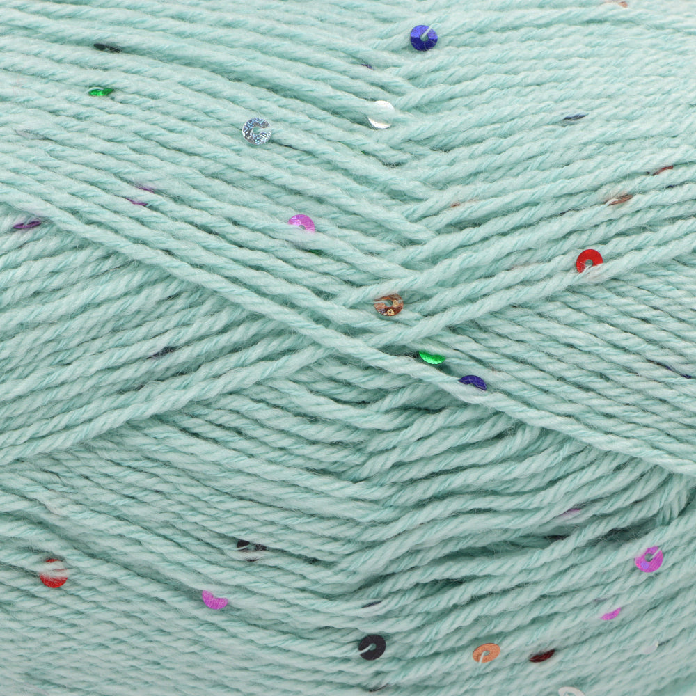 Close-up of mint green yarn with scattered small multicoloured sequins 