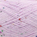 Close-up of light lavender yarn with scattered small sequins in red, green, blue, and gold.