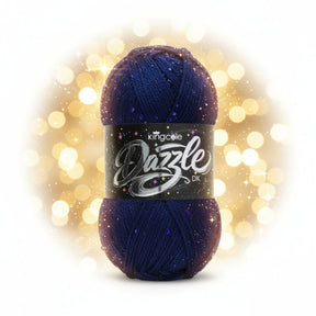 A skein of King Cole Dazzle DK yarn in a deep navy blue colour with subtle sequins throughout, wrapped in a black label with silver and white lettering.