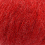 A close-up texture shot of bright red mohair yarn, showing the fine, fluffy fibres.