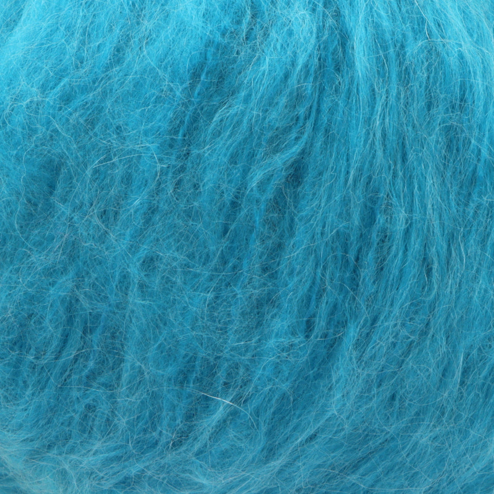 A close-up texture shot of fluffy, curly turquoise blue yarn showing individual strands and a soft, fibrous surface.